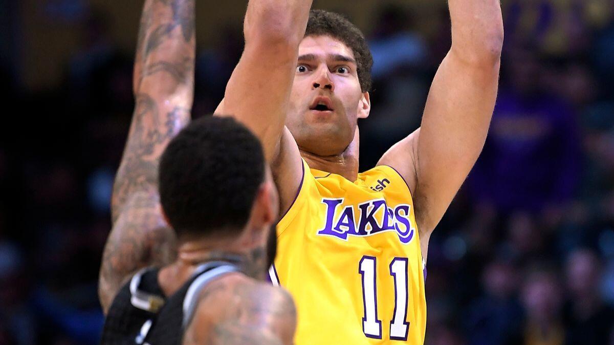 Lakers center Brook Lopez shoots as Sacramento Kings center Willie Cauley-Stein defends during the second half on Tuesday.