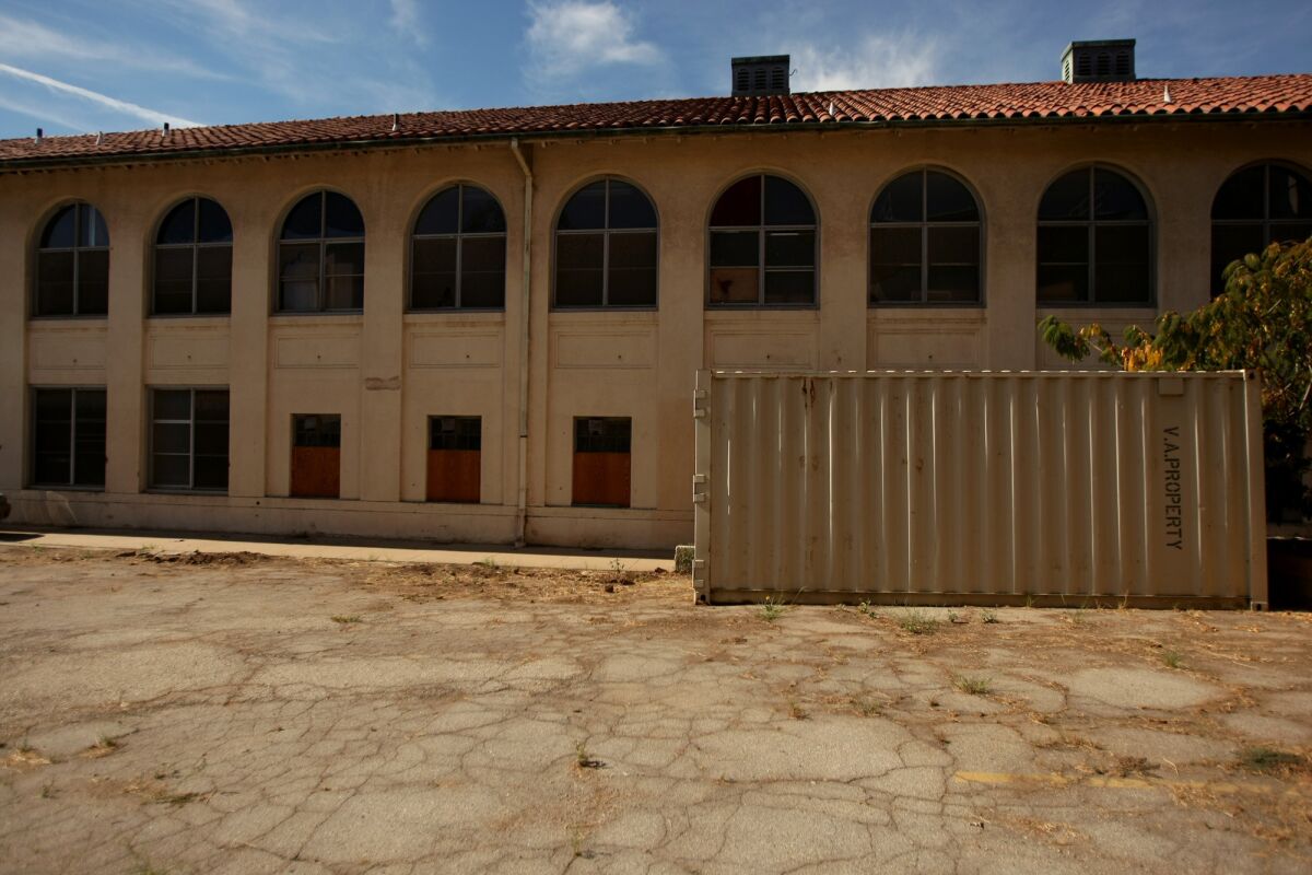 Building 157 on the Veterans Affairs campus in West Los Angeles sits vacant and dilapidated. A House subcommittee assailed officials for leasing out property instead of renovating old buildings to house homeless veterans.