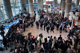 SEOUL, KOR - MAR 15, 2024: A view of all the commotion from news organizations and a fan group as Los Angeles Dodgers pitcher Shohei Ohtani arrives at Incheon Airport on Friday March 15, 2024 in Seoul, South Korea . (Max Kim / Los Angeles Times)