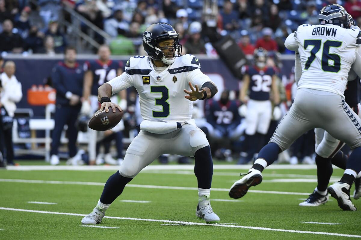 Seattle Seahawks quarterback Russell Wilson looks to pass against the Houston Texans.