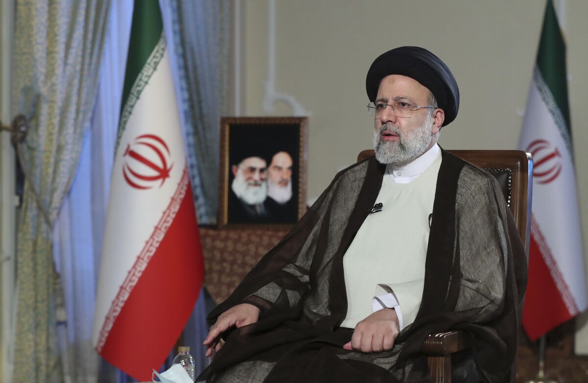 In this photo released by the office of the Iranian Presidency, President Ebrahim Raisi speaks during a live interview in Tehran, Iran, broadcast on state-run TV on Monday, Oct. 18, 2021. (Iranian Presidency Office via AP)
