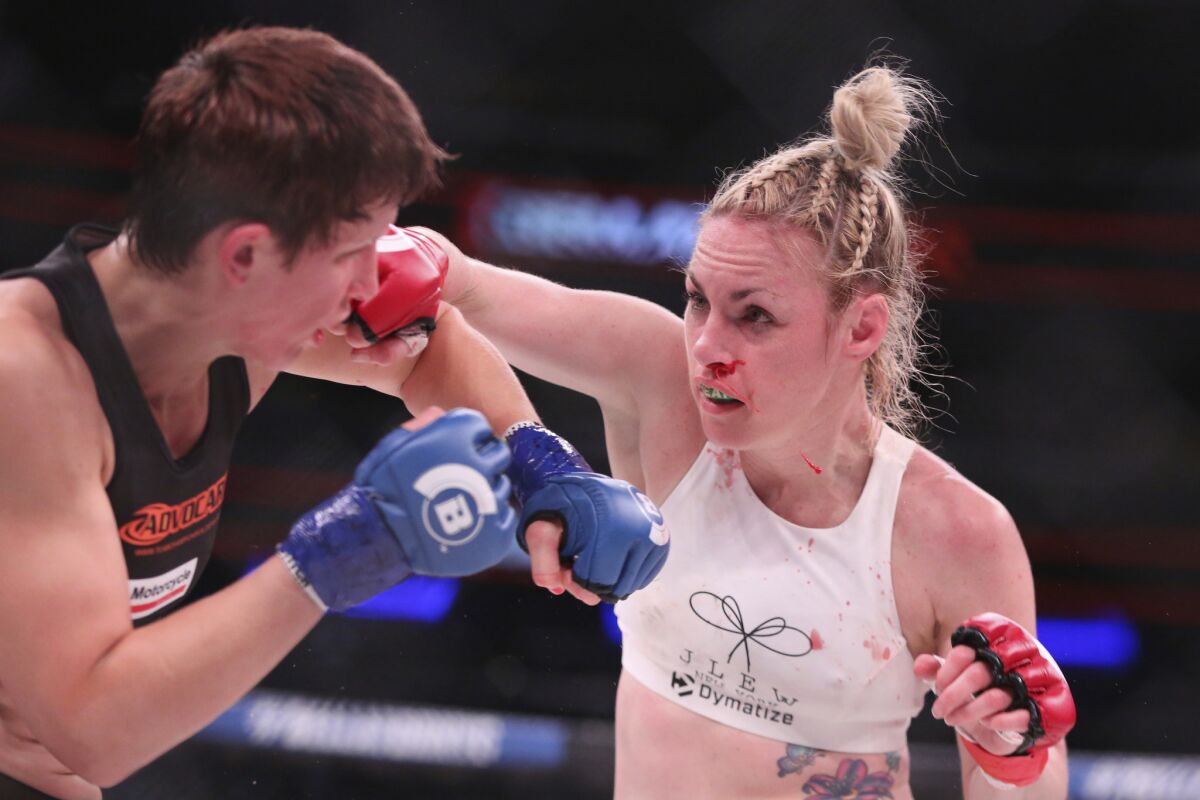 Heather Hardy, right, lands an overhand right against Alice Yauger during Bellator NYC.