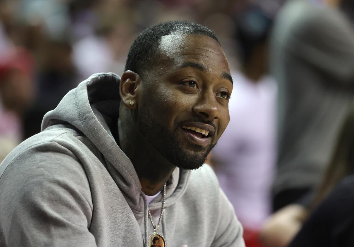 John Wall attends an NBA Summer League game Thursday in Las Vegas.