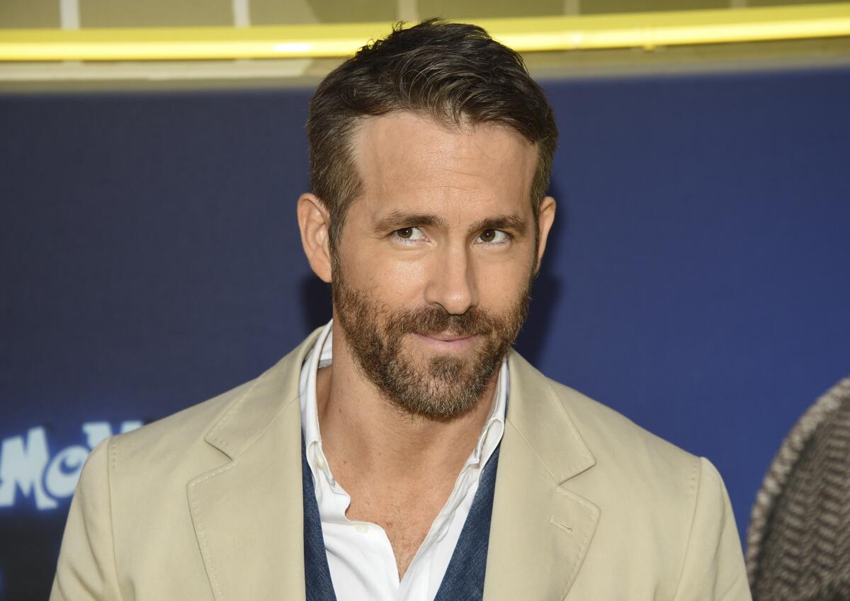 Actor Ryan Reynolds in a light-colored sport coat