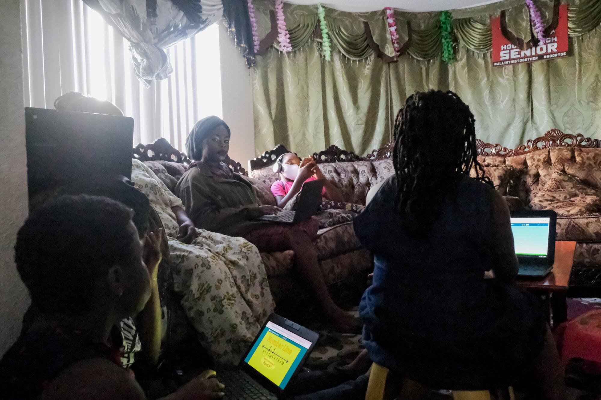 Consolata Shabani, 38, attends a Zoom ESL class from her living room