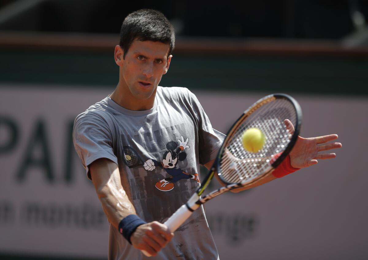 Novak Djokovic returns the ball during a training session for the French Open.