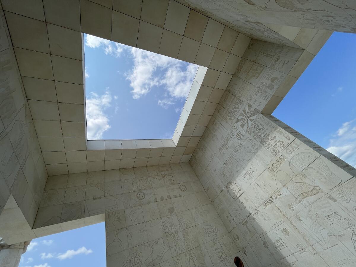 A square oculus reveals a piece of bright sky in an art installation designed to resemble an ancient Egyptian temple