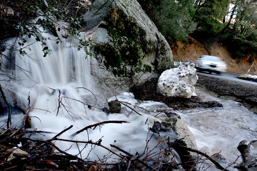 Snowmelt stream along Highway 138 near Crestline on Thursday.