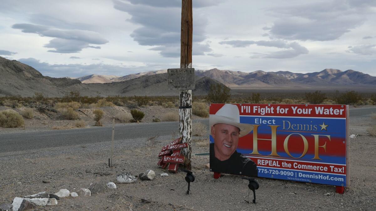 An election sign for Dennis Hof near the Love Ranch brothel he owned outside Pahrump, Nev. Hof, who died last month, won his election Tuesday.
