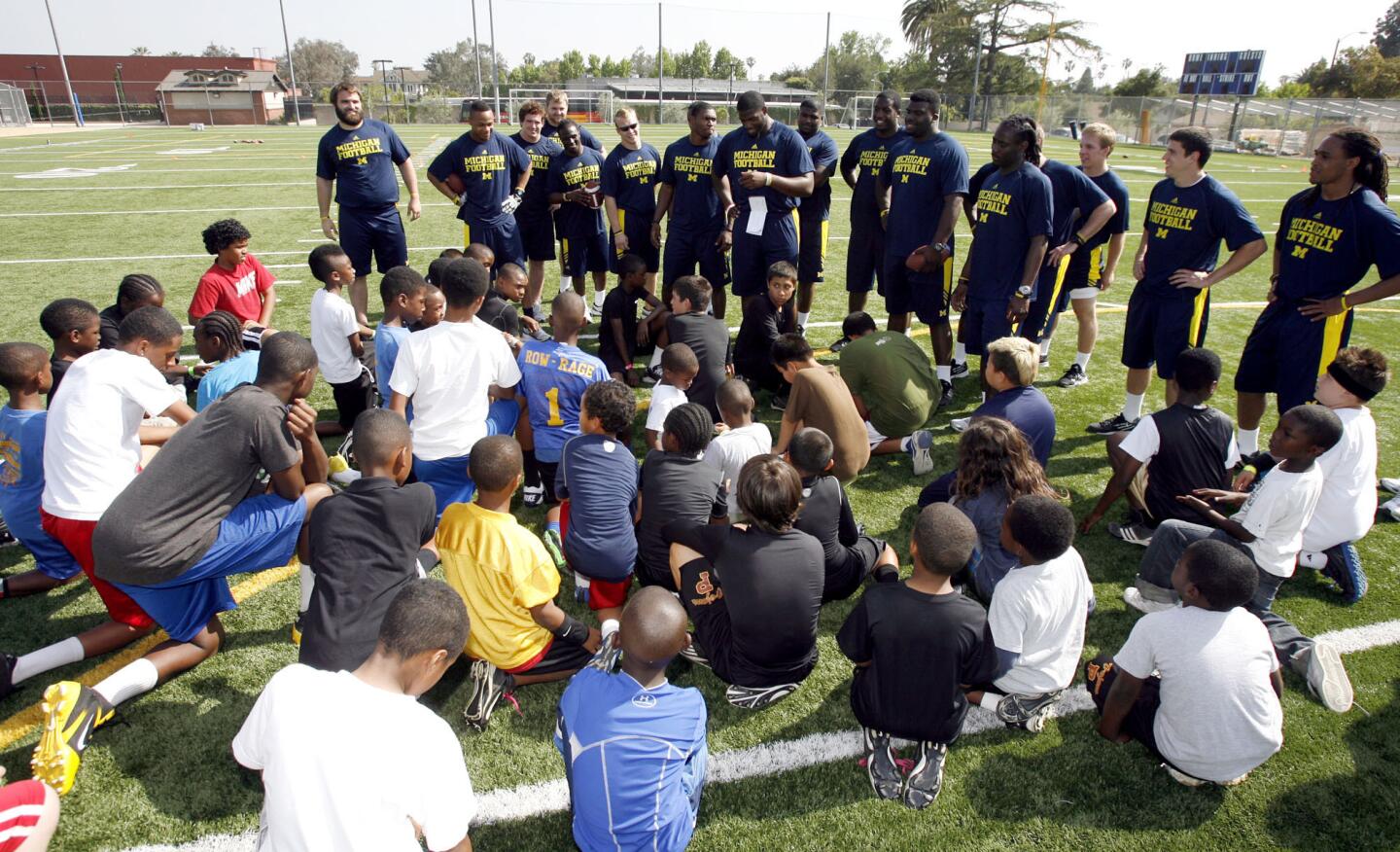 Photo Gallery: University of Michigan football players help local kids