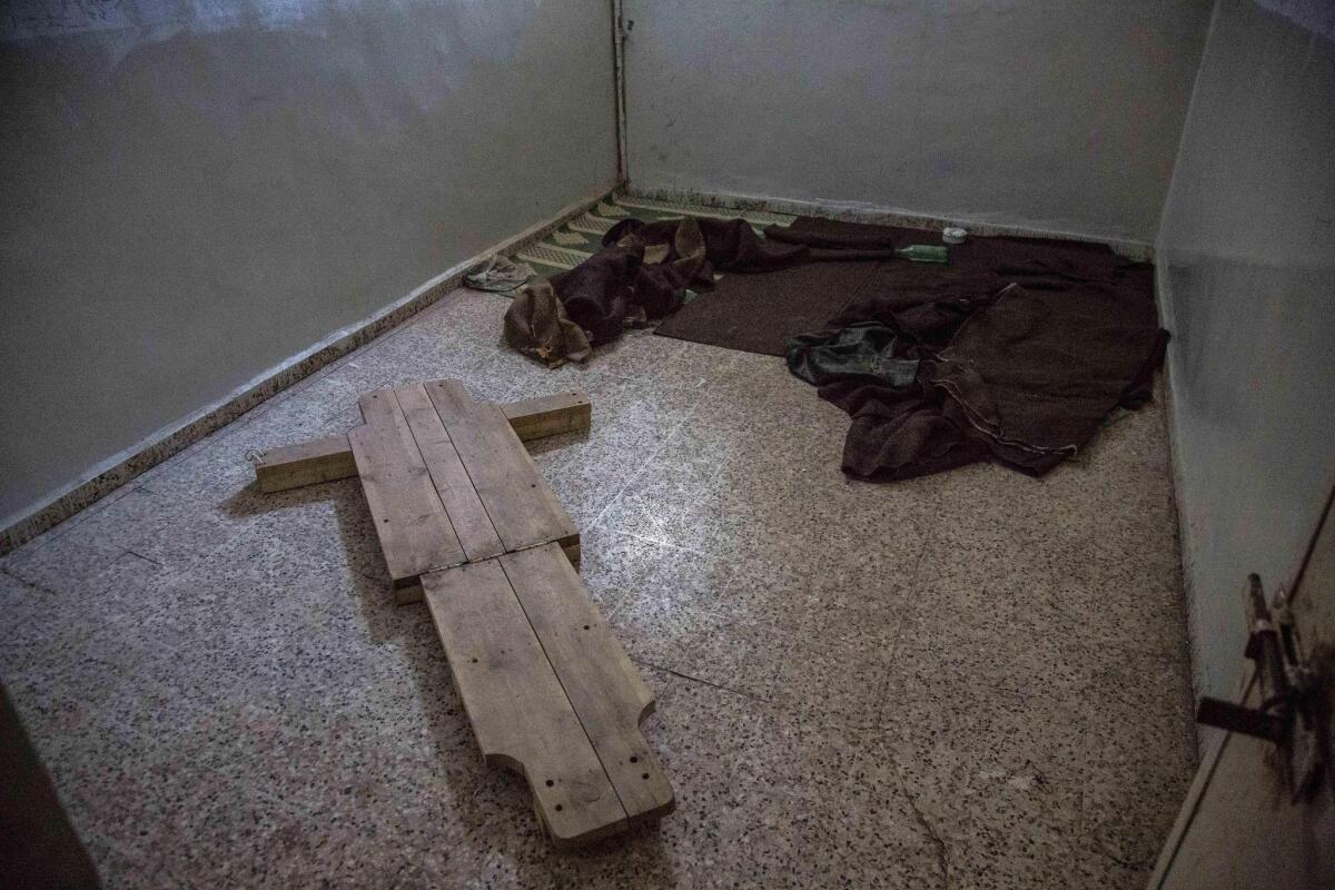 A photo released by Human Rights Watch shows a torture device on the floor of a government security building in Raqqah, Syria. Rights activists visiting abandoned government prisons there say they have found evidence of detainee abuse. (Bryan Denton, Associated Press)