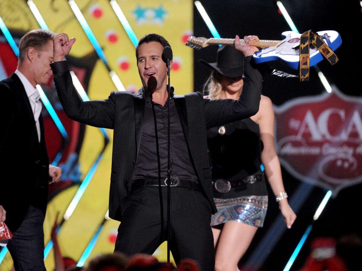 Luke Bryan, shown accepting his artist of the year award at the American Country Awards in December in Las Vegas, will headline the first iHeartRadio Country Festival slated for March 29 in Austin, Texas.