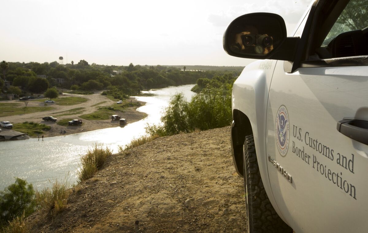A U.S. Border Patrol agent keeps watch along the Rio Grande in Texas.