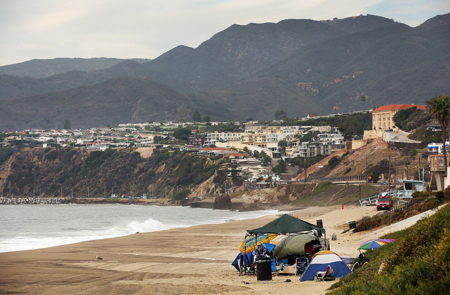A collection of tents along Will Rogers State Beach. Pacific Palisades residents have taken it upon themselves to help pay for homeless services.