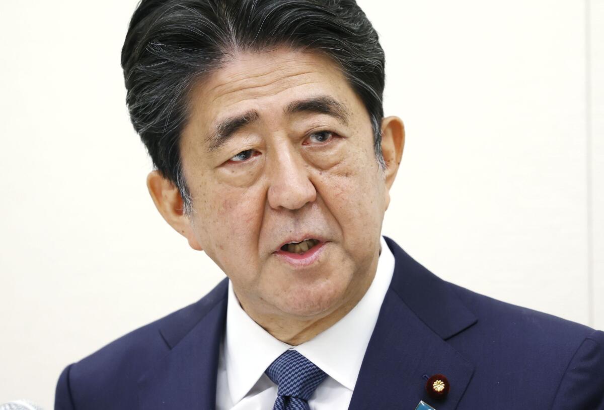 Former Japanese Prime Minister Shinzo Abe speaks during a press conference in Tokyo on Thursday. 