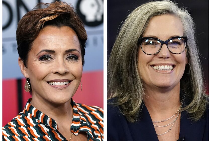 In this combination of photos Arizona gubernatorial candidates, Republican Kari Lake, left, appears before a PBS televised debate on June 29, 2022, in Phoenix and Democrat Katie Hobbs smiles prior to a televised interview in Phoenix, Oct. 18, 2022. (AP Photo/Ross D. Franklin)