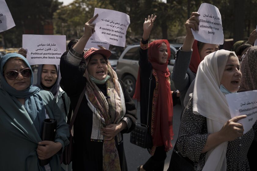 Women march to demand their rights under the Taliban rule during a demonstration near the former Women's Affairs Ministry building in Kabul, Afghanistan, Sunday, Sept. 19, 2021. The interim mayor of Afghanistan’s capital said Sunday that many female city employees have been ordered to stay home by the country’s new Taliban rulers. (AP Photo)
