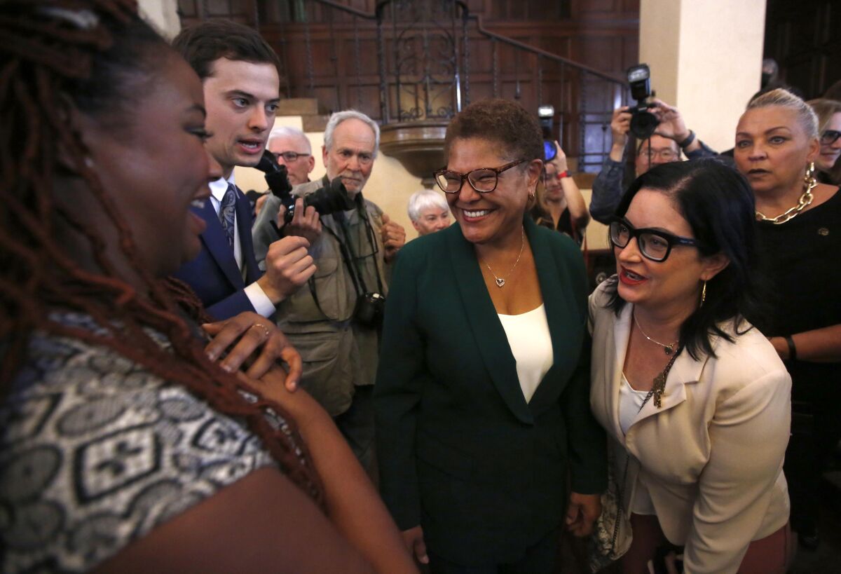 Los Angeles Mayor-elect Karen Bass greets supporters at the Wilshire Ebell Theatre on Thursday.