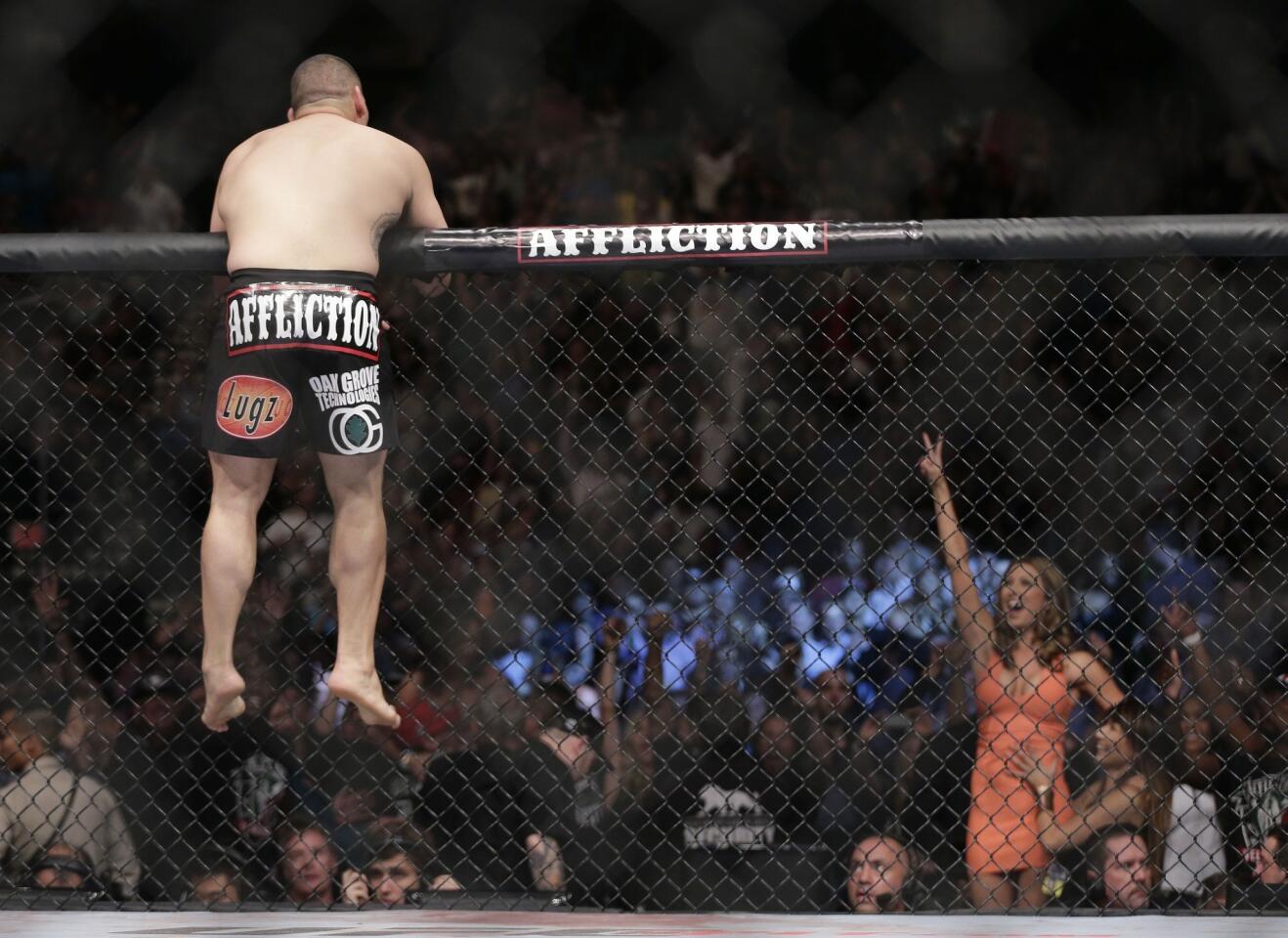 Cain Velasquez celebrates after defeating "Bigfoot" Silva to retain his UFC heavyweight belt on Saturday night.