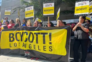 Los Angeles, California-Aug. 24, 2023-Hotel workers represented by Unite Here Local 11 picketed outside the JW Marriott Hotel in downtown Los Angeles on Thursday morning, Aug. 24, 2023. After several tense and sometimes violent incidents on hotel picket lines, the union on Thursday calling for a boycott of hotels who have not yet reached a contract. (Suhauna Hussain/Los Angeles Times)