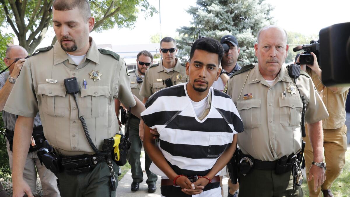 Cristhian Bahena Rivera is escorted into the Poweshiek County Courthouse in Montezuma, Iowa. Rivera is charged with first-degree murder in the death of Mollie Tibbetts.