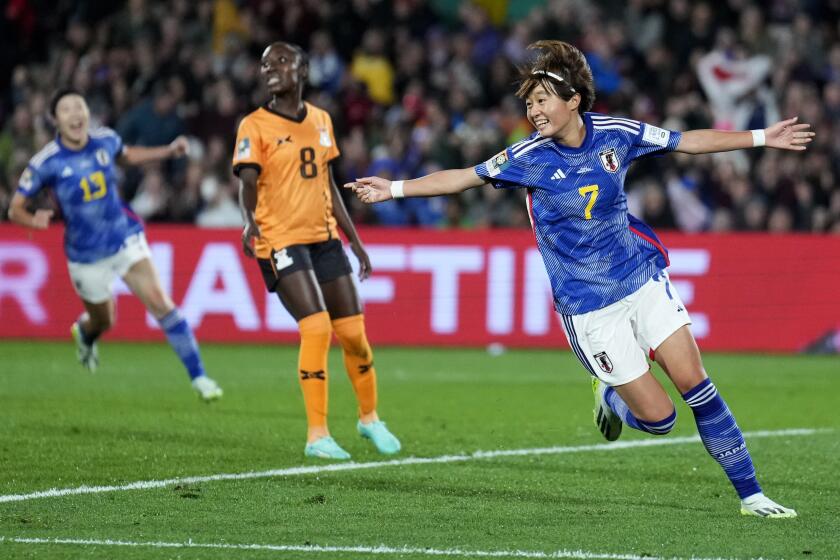Japan's Hinata Miyazawa reacts after scoring her team's first goal during a World Cup match against Zambia 