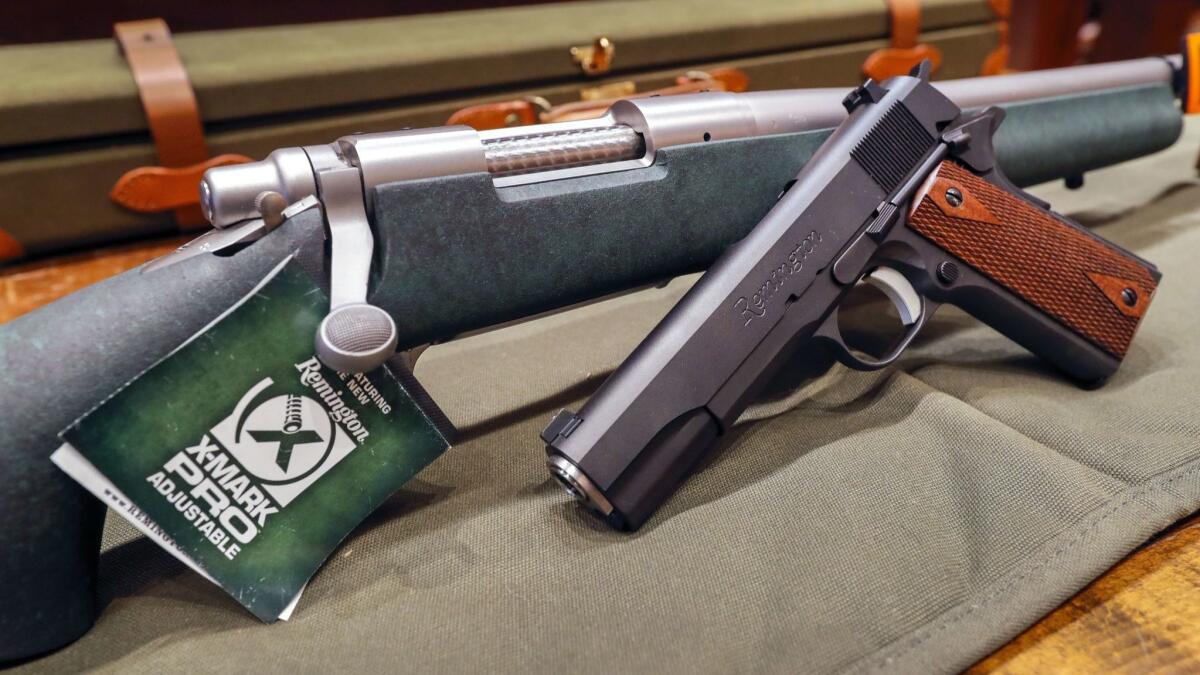 A Remington rifle and handgun on display at a firearms store in Atlanta.