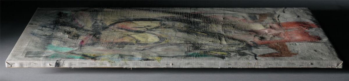 A damaged painting on its side