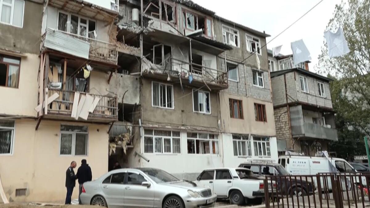 A damaged apartment building following shelling