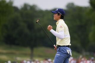 Yuka Saso, of Japan, reacts on the 18th green during the final round of the U.S. Women's Open.