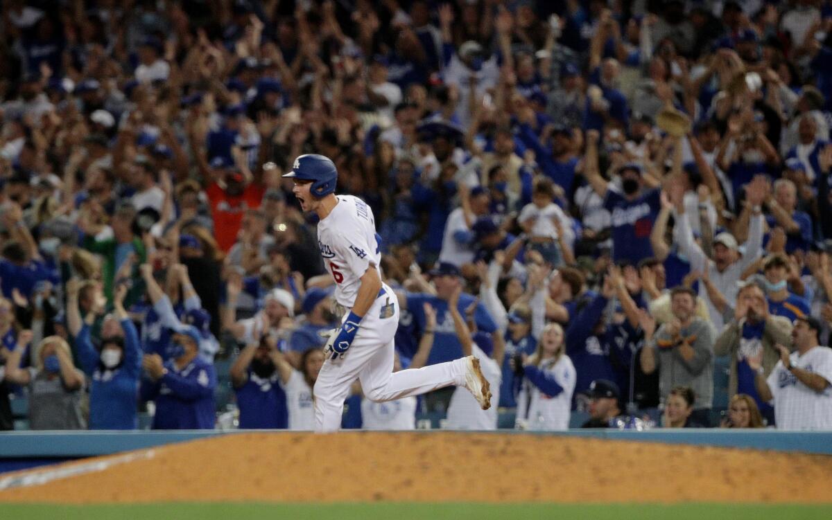 Dodgers shortstop Trea Turner celebrates after hitting a grand slam home run in the fifth inning Friday.
