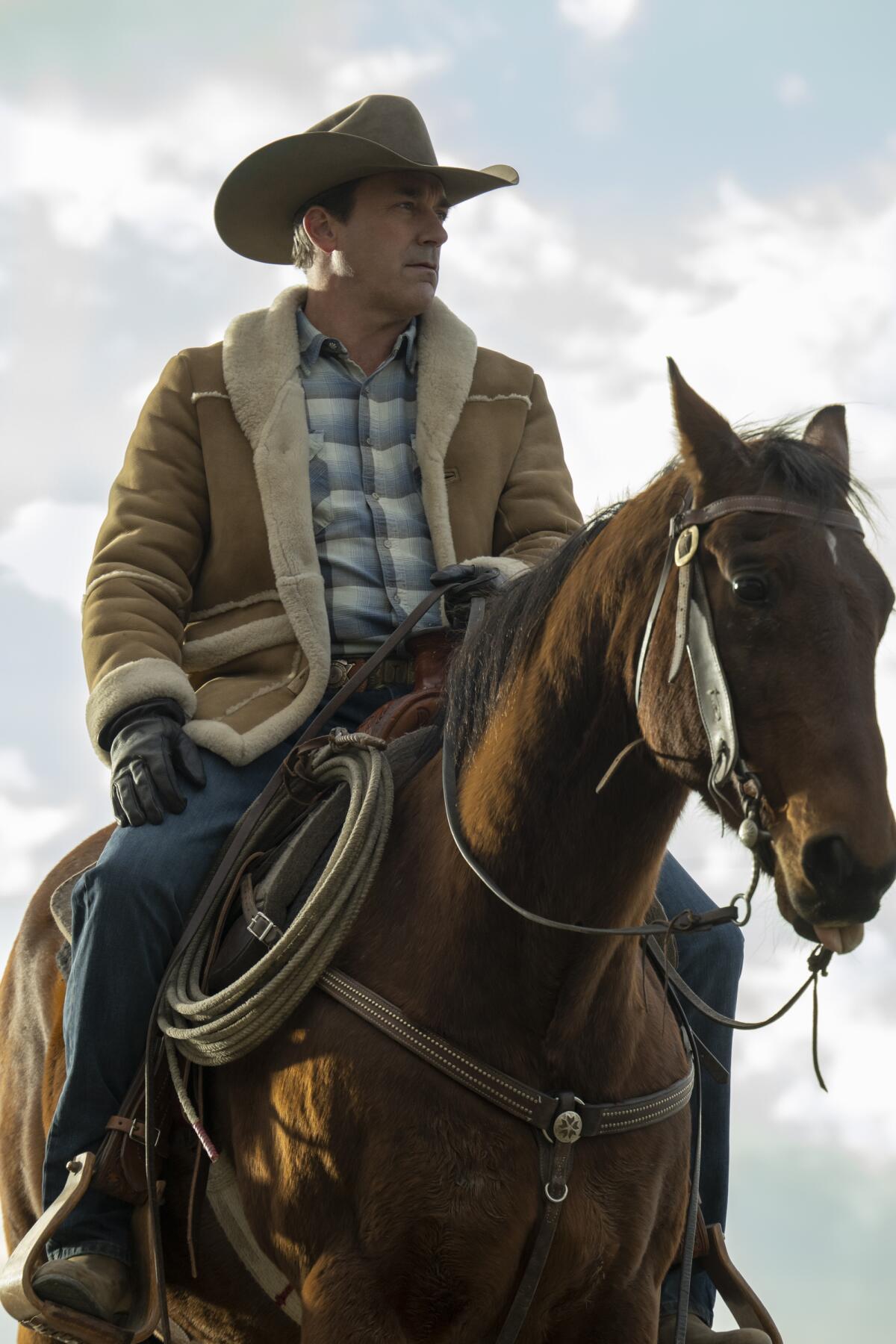 A man in a cowboy hat rides a horse in "Fargo" Season 5.