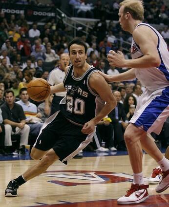 San Antonio Spurs Manu Ginobili drives on Clippers Chris Kaman.