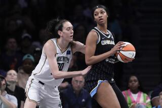New York Liberty's Breanna Stewart defends against Chicago Sky's Angel Reese 