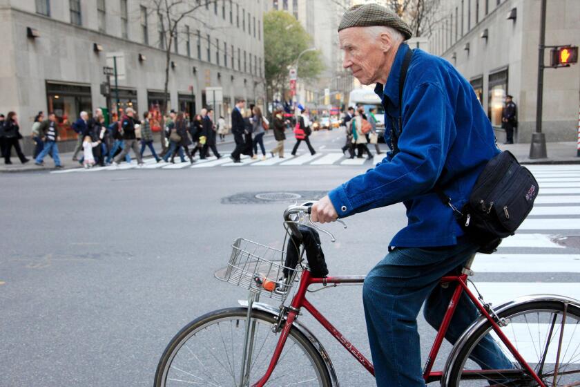 Photographer Bill Cunningham cycling to work in New York City in 2010.