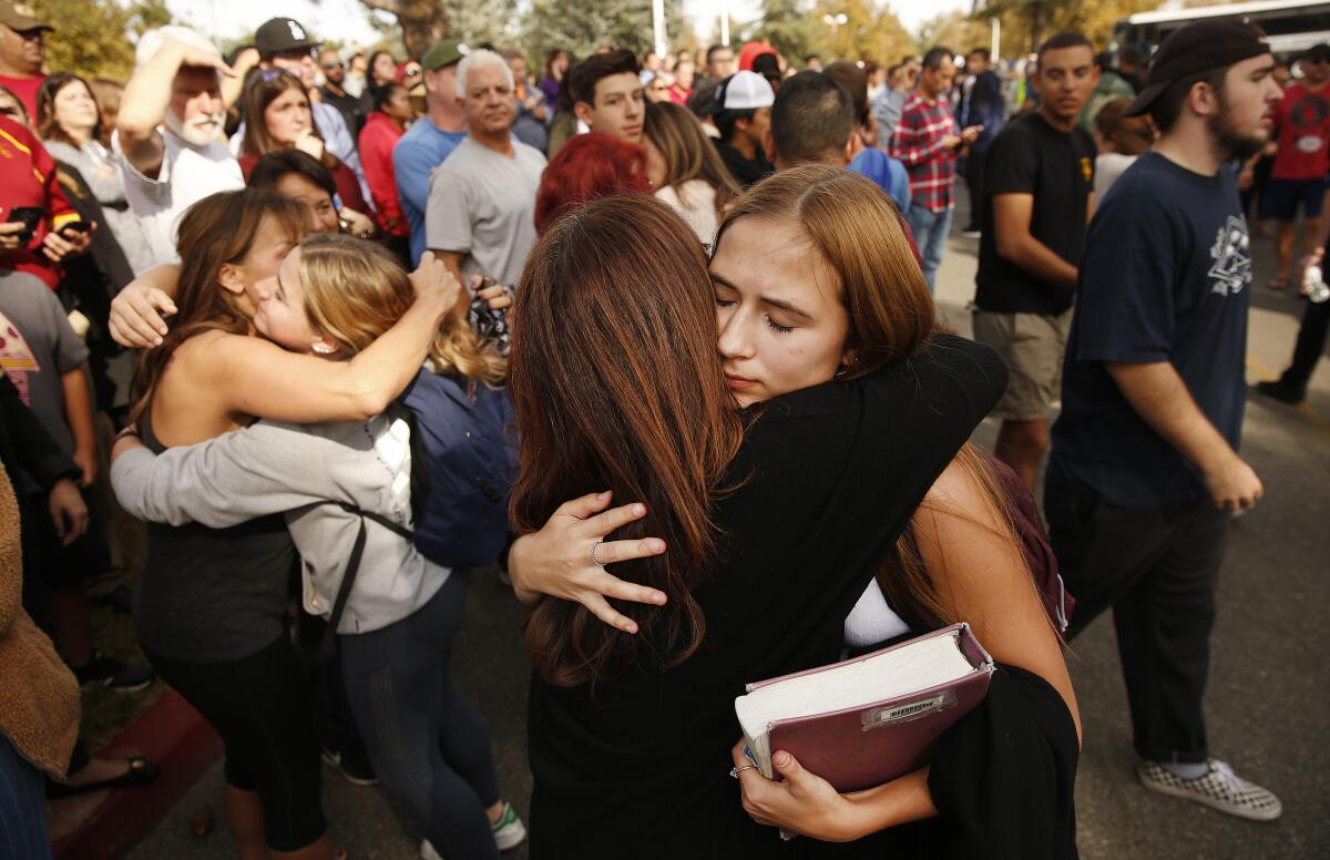 Students reunite with parents at Central Park in Santa Clarita following Thursday's shooting at Saugus High School.
