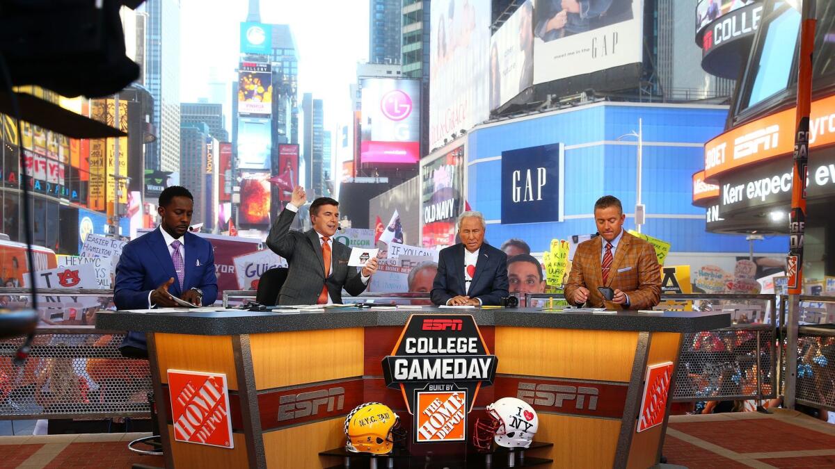 ESPN has been struggling with subscriber losses and ratings declines. Above ESPN's "College GameDay" show Saturday in New York.