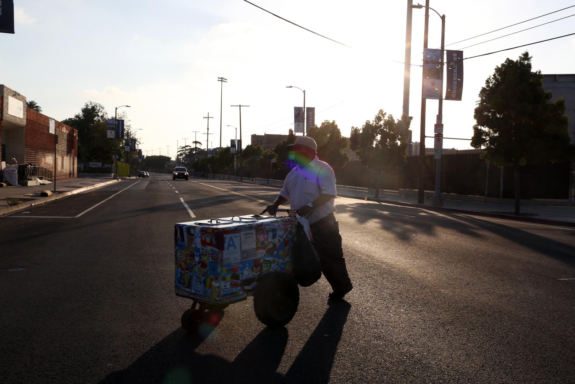 Rios crosses the street at the end of his day.