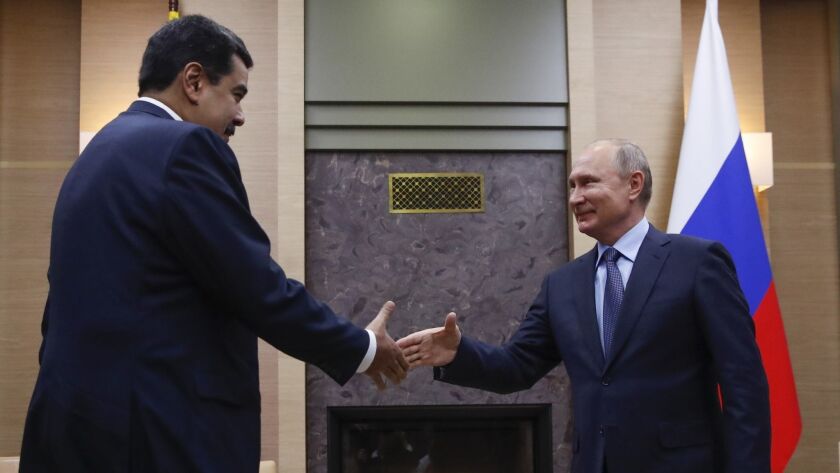 Venezuelan President Nicolas Maduro, left, a pariah in many world capitals, has been a frequent guest of Russian President Vladimir Putin, shown here meeting outside Moscow on Dec. 5.