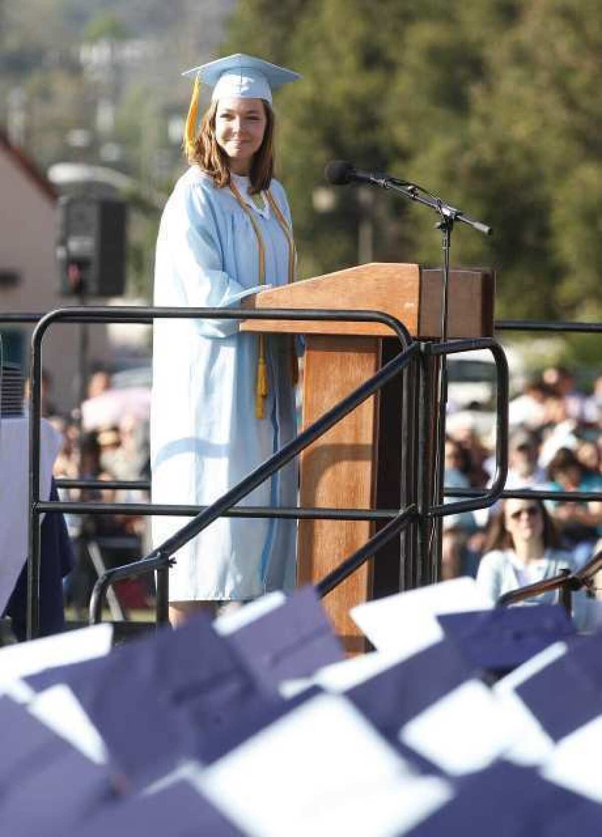 Crescenta Valley High School graduate Carrie Ostler gives the senior address at the school's commencement ceremony at Glendale Community College.