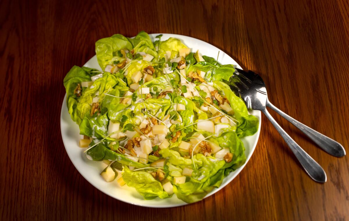 A pear and Gruyere cheese salad with butter lettuce