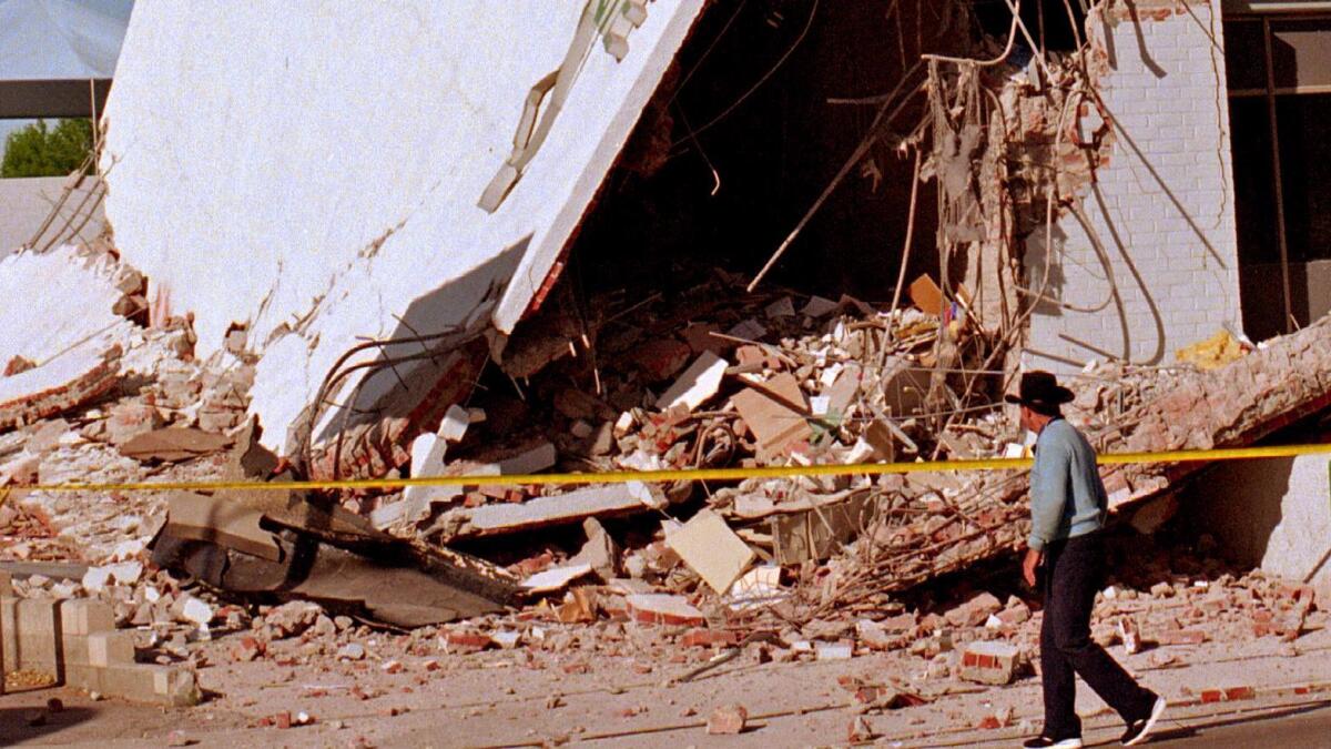 Magnitude 6.7: Both ends of this medical administration building collapsed, and the second floor pancaked. (Ricardo DeAratanha / Los Angeles Times)