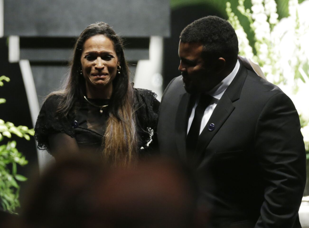 Muhammad Ali's daughter, Rasheda Ali-Walsh, cries after speaking during his memorial service.