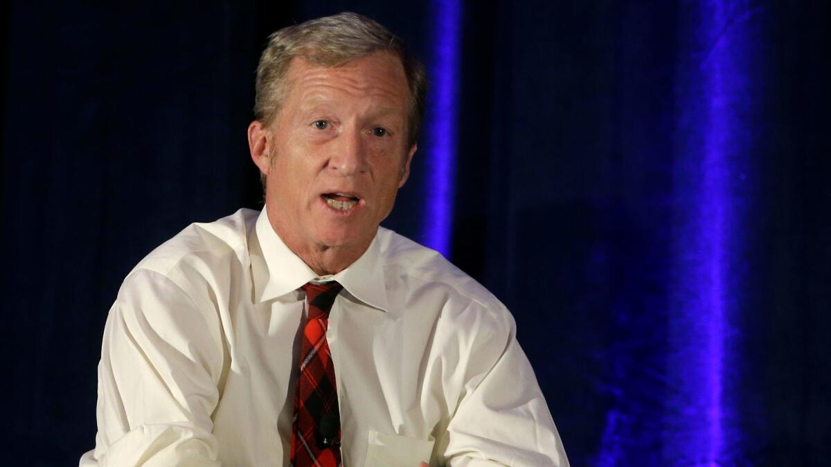 Billionaire environmentalist Tom Steyer discusses climate change at a symposium in Sacramento in 2015.