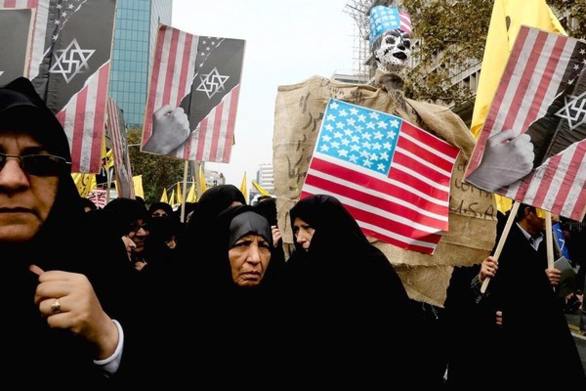 People attend a demonstration in Tehran marking the anniversary of the 1979 U.S. Embassy takeover.