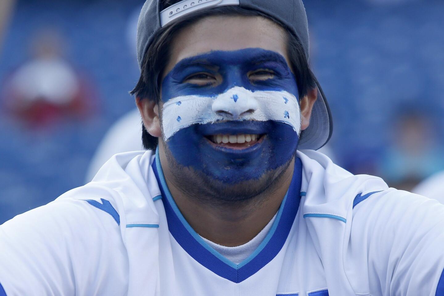 A Honduras fan smiles with face-paint before the CONCACAF Gold Cup match between Honduras and Panama in Foxborough, Massachusetts on July 10, 2015. AFP PHOTO/ DOMINICK REUTERDOMINICK REUTER/AFP/Getty Images ** OUTS - ELSENT, FPG - OUTS * NM, PH, VA if sourced by CT, LA or MoD **
