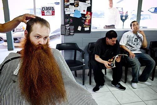 Jack Passion, ranking "full beard" title holder of the World Beard and Moustache Championships, gets a haircut at the Clip Joynte in Walnut Creek, Calif., in preparation for the upcoming championship in Anchorage. "People are gunning for me," he says of his rivals.