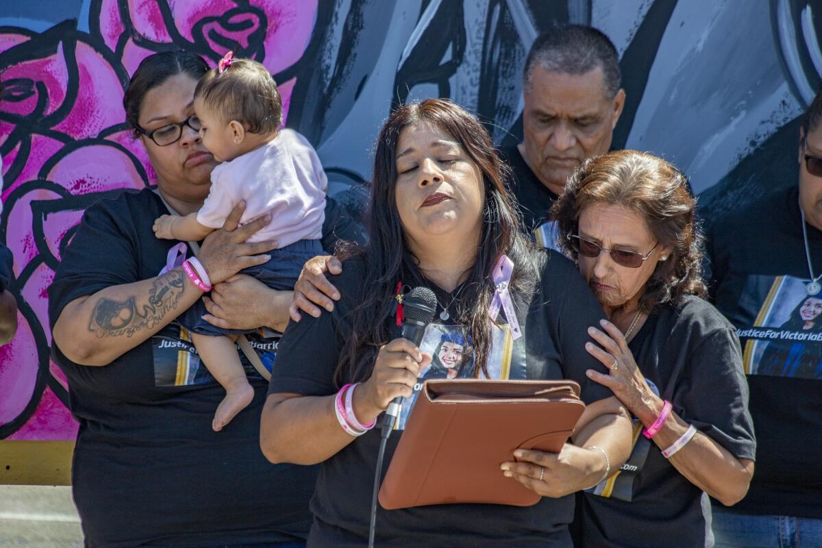 Eva Barrios chokes up as she reads a tribute to her daughter, Victoria.