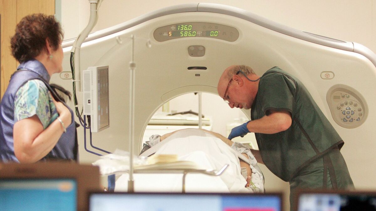 A CT scanner, which will check for signs of lung cancer. (Jim Cole / Associated Press)