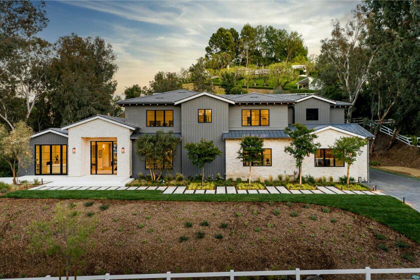 Built in 2020, the amenity-loaded home spans nearly 10,000 square feet with six bedrooms, 7.5 bathrooms, a movie theater, wine cellar and gym.